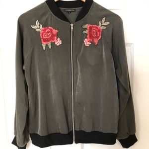 Green bomber jacket with rose detailing